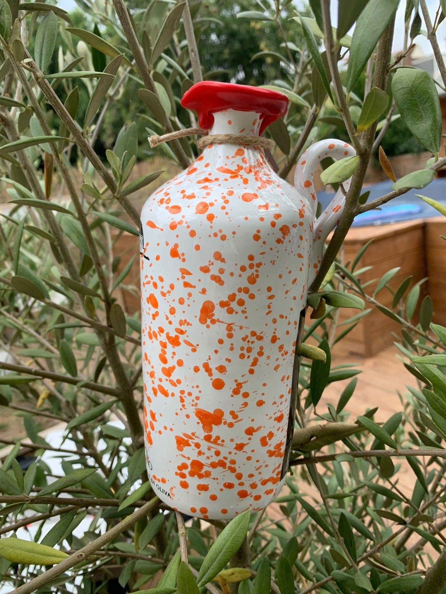 Orange Speckled terracotta jar – Containing our extra virgin olive oil
